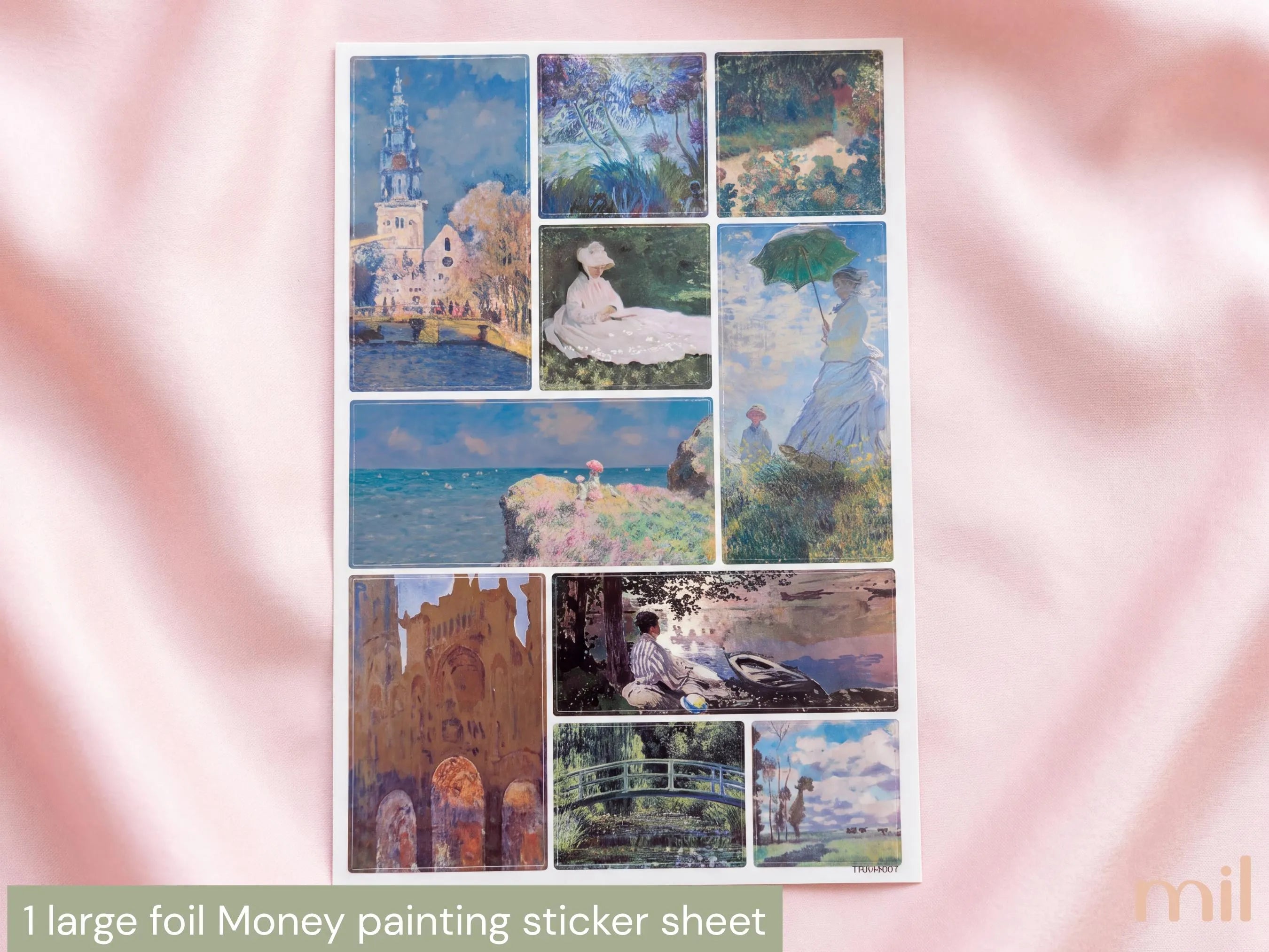 A sheet of 11 small rectangular foil stickers featuring impressionist paintings, displayed on a soft pink satin fabric background. The stickers depict scenes such as a tower by the water, a woman in a white dress, a coastal landscape, and a bridge over water.