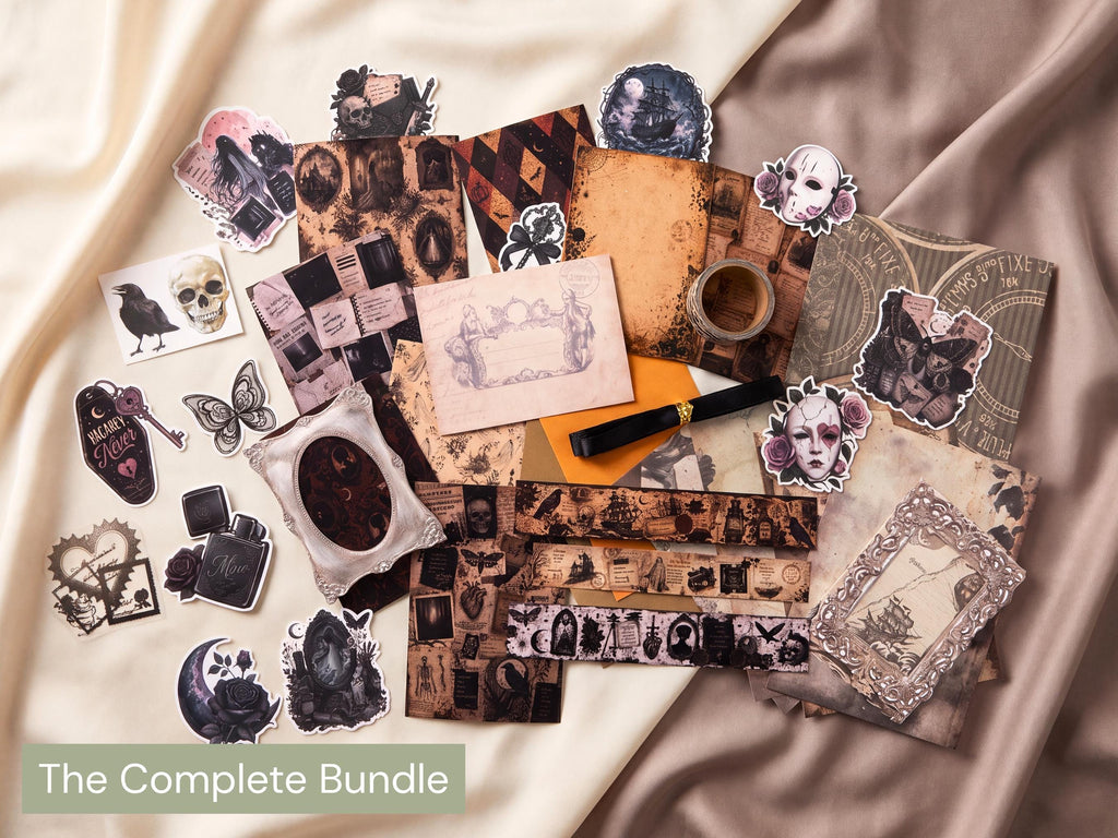 A flat-lay display of a gothic-themed sticker and scrapbook paper bundle titled 'The Complete Bundle'. The collection features various vintage-style stickers, patterned paper strips, and decorative cards with gothic illustrations such as skulls, crows, roses, and portraits, arranged on draped beige satin fabric.