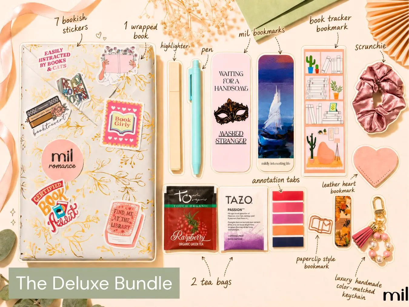 A collage-style promotional layout for a bundle titled 'The Deluxe Bundle,' showing multiple stationery and small accessory items arranged on a warm beige background with decorative illustrations and handwritten labels. Visible items include a decorated notebook or journal, a wrapped book, a pen, bookmark cards, highlighter paper, annotation tabs, tea bags, a leather heart bookmark, a bookmarks card, a scrunchie, and a keychain.