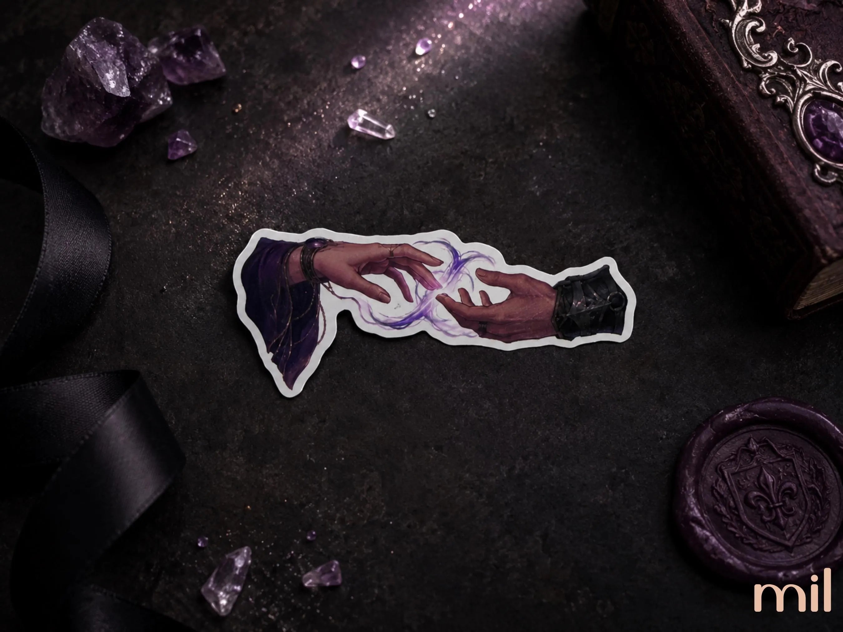 A die-cut sticker featuring two hands reaching toward a glowing purple and white energy swirl, styled on a dark textured surface with purple crystals, black ribbon, an ornate book, and a wax seal.
