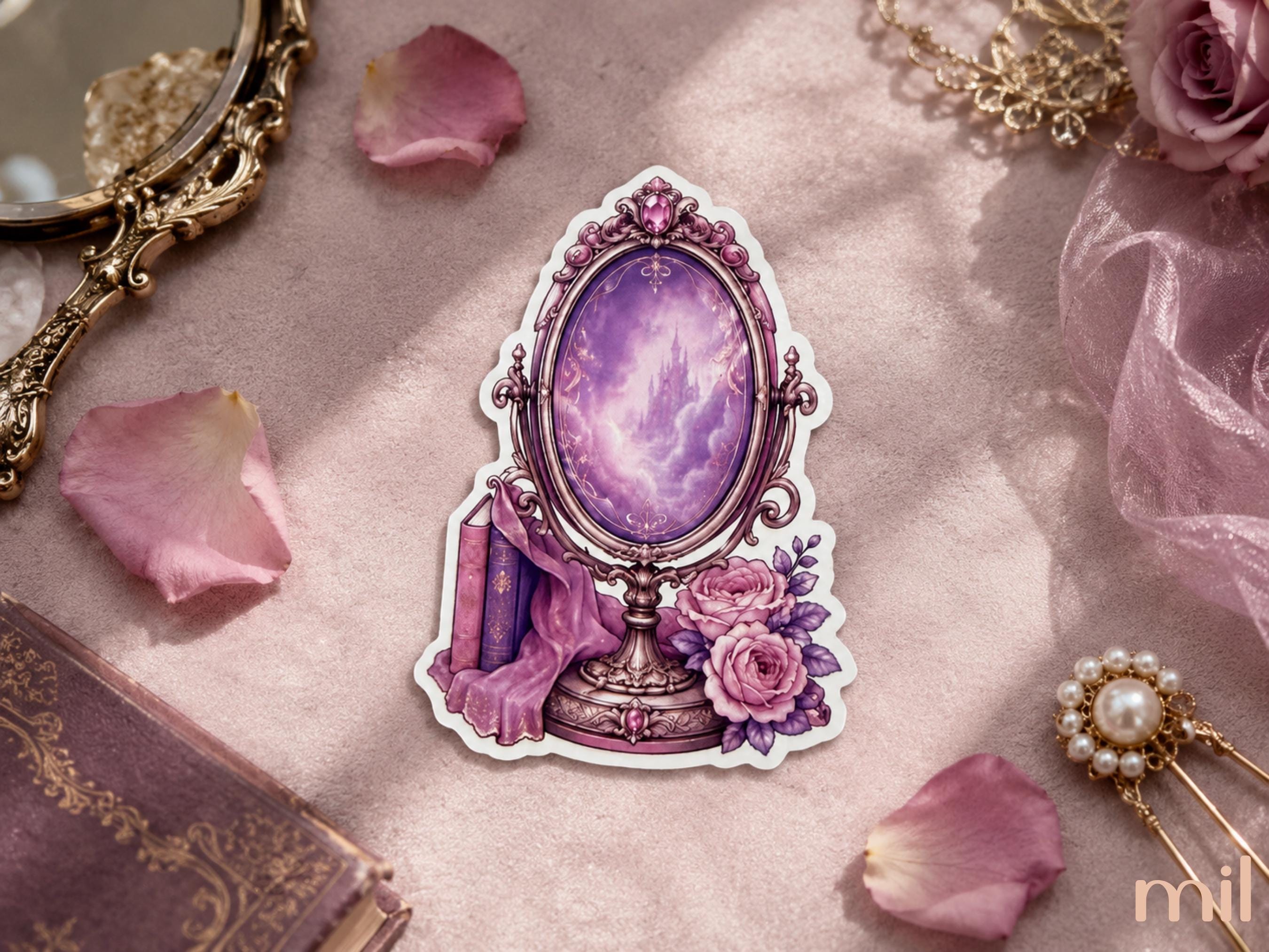 A die-cut sticker featuring an ornate purple mirror with a glowing violet reflection, pink roses, and books, displayed on a soft pink fabric surrounded by decorative rose petals and vintage-style accessories.