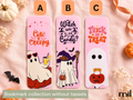 Three Halloween-themed bookmarks labeled A, B, and C displayed on a pink fabric background with autumn props. The bookmarks feature pink backgrounds with ghost and witch illustrations and text reading 'Cute & Creepy,' 'Witch Way to the Candy,' and 'Trick or Treat.